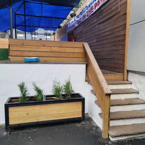 The stairway for the elevated area at The Outer Space (Bronx, NY) outdoor event venue. It is available for a private family gathering or party with friends.